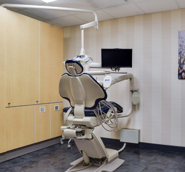 man smiling in dentists chair