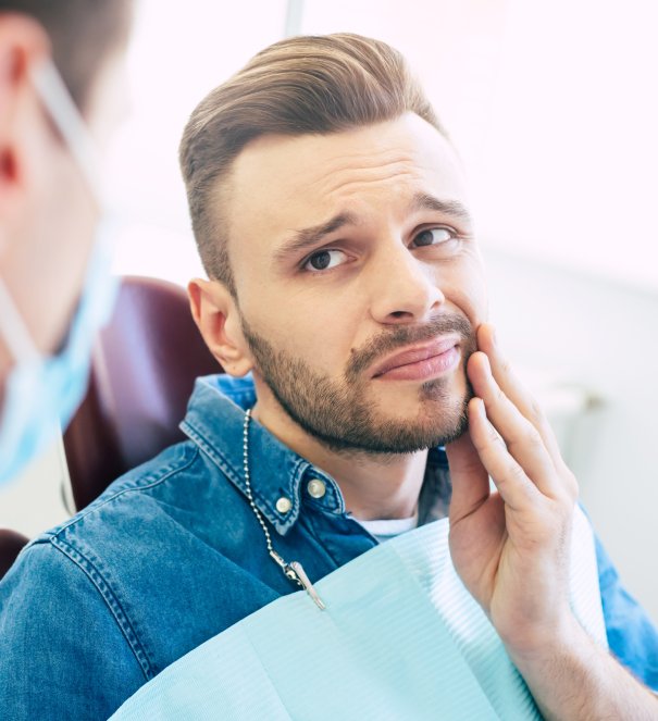 man smiling in dentists chair