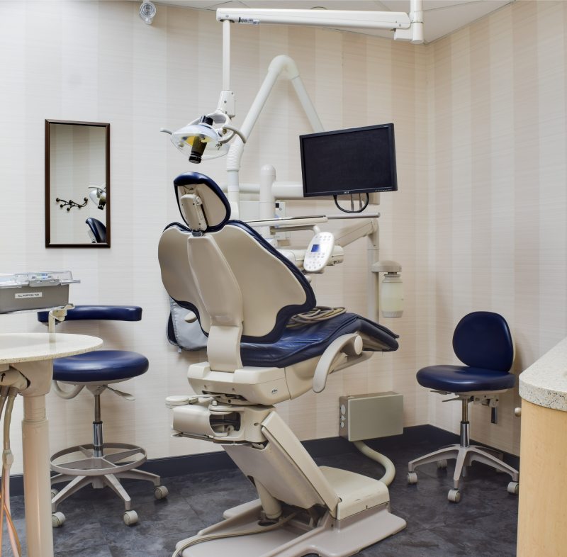 man smiling in dentists chair