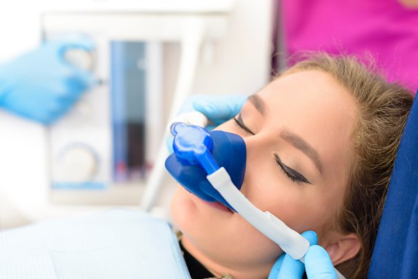 man smiling in dentists chair