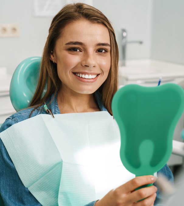 man smiling in dentists chair