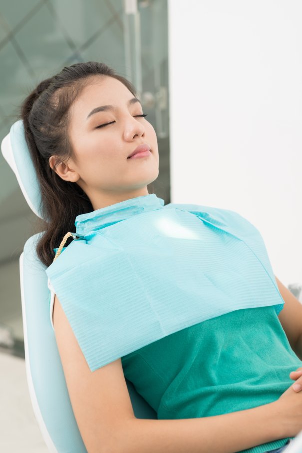 man smiling in dentists chair